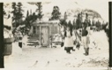 Image of Eskimo [Inuit] house below camp with Edward Aggek and Frances